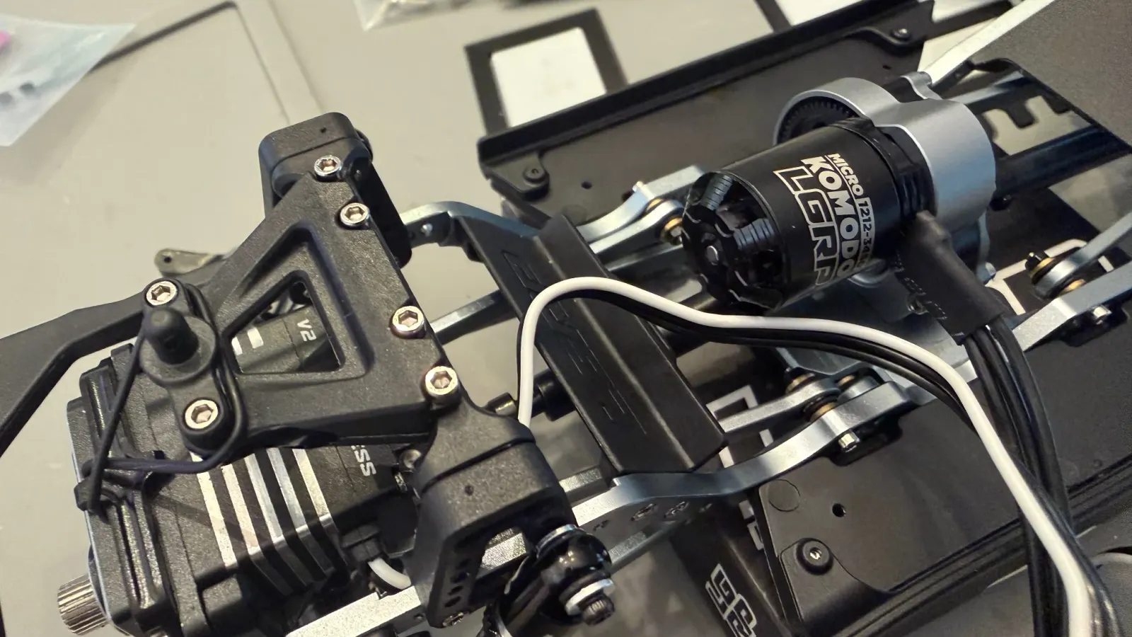 Close up of an SCX24 servo and motor during a repair