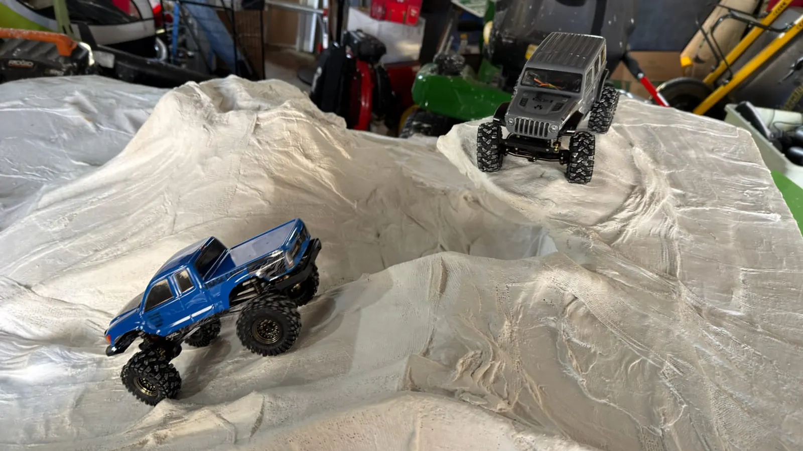 A stock SCX24 Base Camp and JLU on a homemade rock course